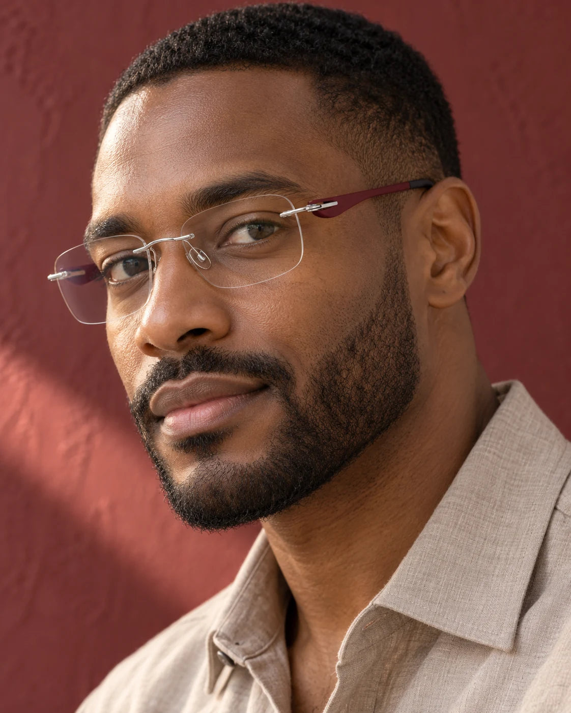 Man wearing Red Wine Titanium Elite 5003 with clear lenses — AI styling preview